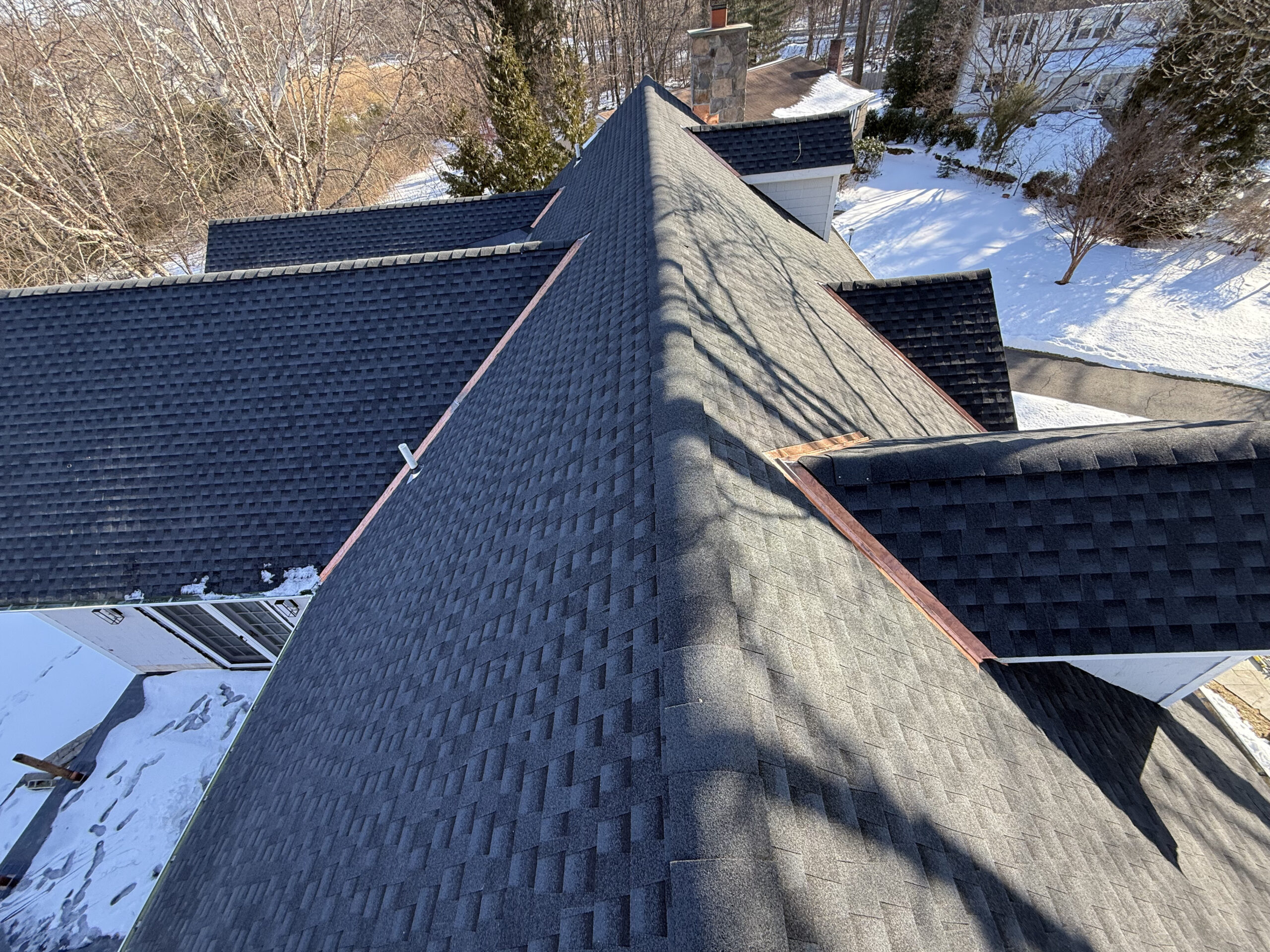 Completed architectural shingle roof replacement on a home in Rye, NY by Your Local Roofer